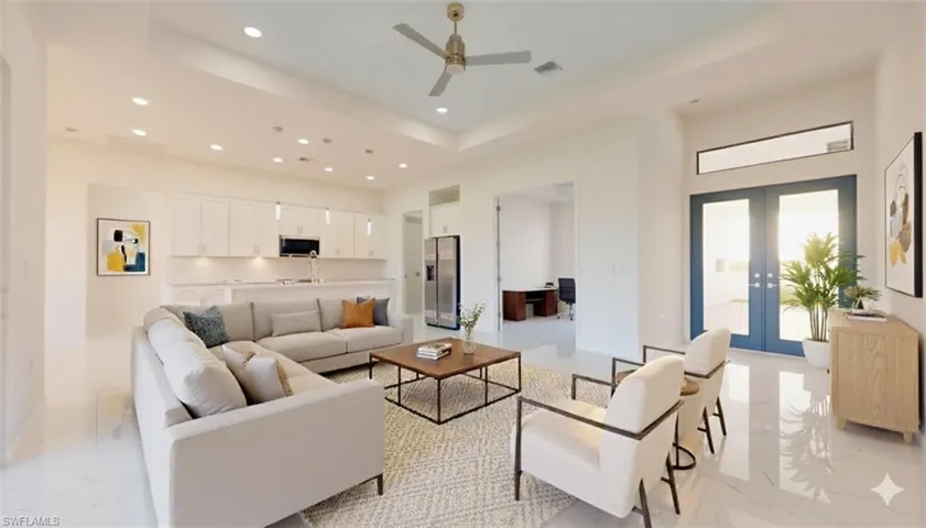 Living area with light marble finish flooring, a tray ceiling, recessed lighting, french doors, and ceiling fan
