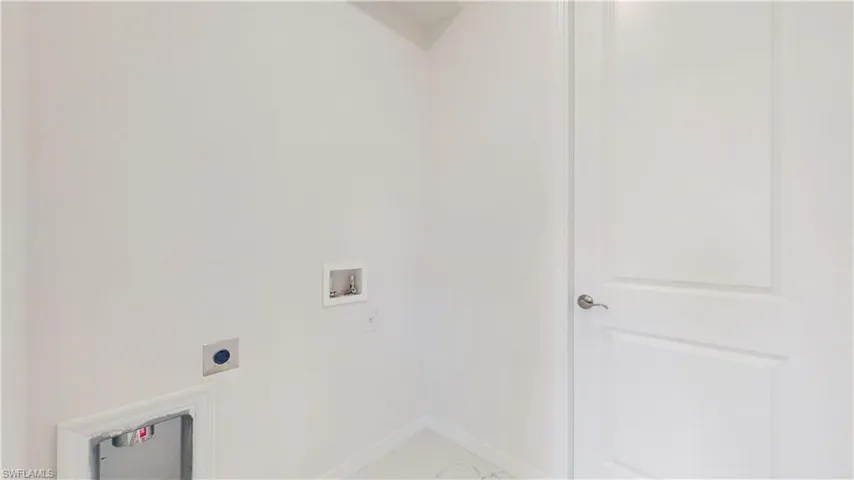 Laundry room featuring hookup for a washing machine and hookup for an electric dryer