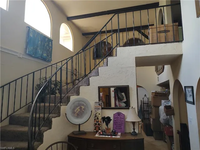 Staircase with tile patterned floors