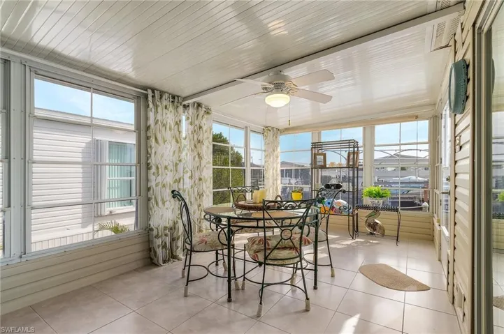 Sunroom with tile floors.