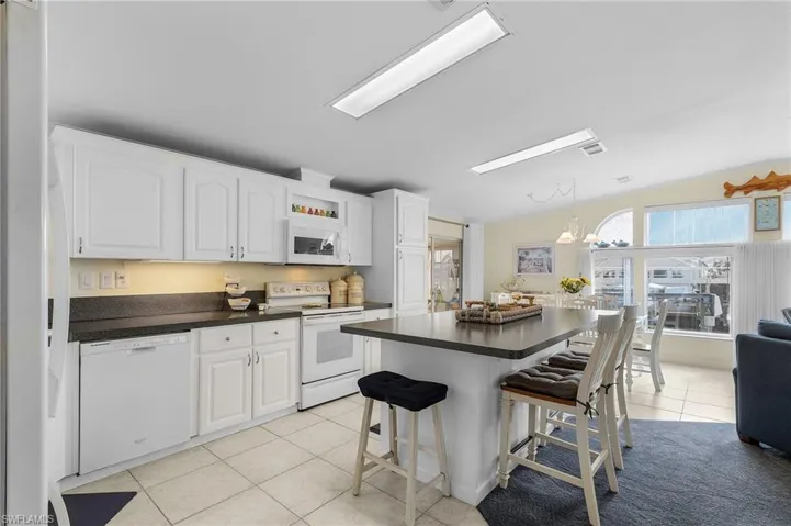 Kitchen with tile floors and island.