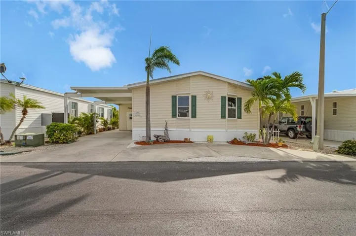 Street view of home with extra parking.
