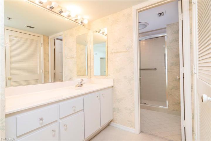 Guest bathroom adjacent to spacious walk-in closet.