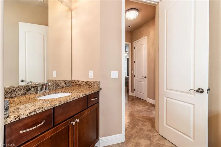 Bathroom with vanity and tile patterned flooring