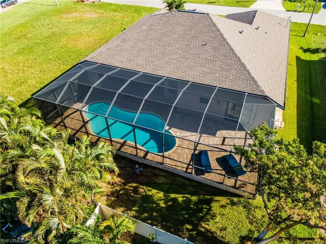 View of pool featuring a lanai, a yard, and a patio area