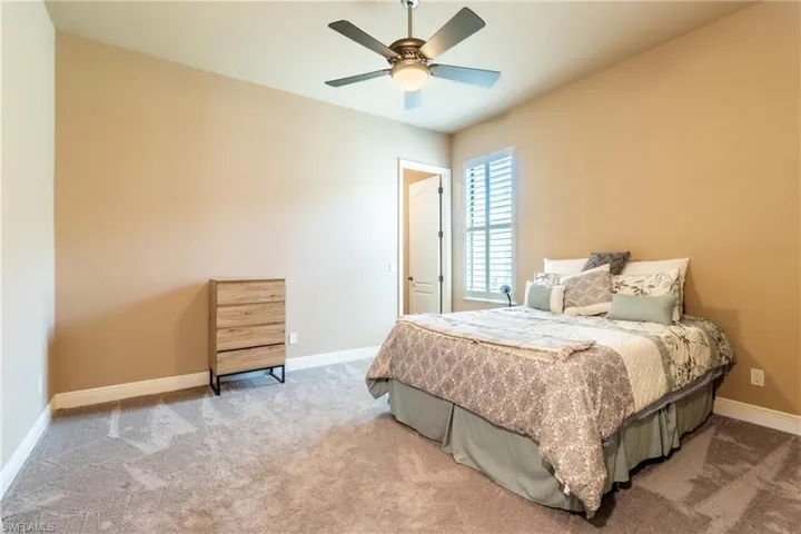 Bedroom with carpet floors and ceiling fan