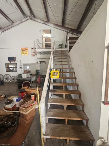 Staircase with vaulted ceiling