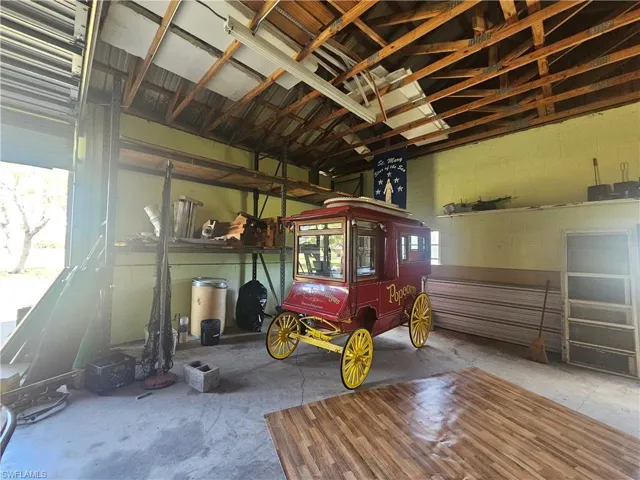 Garage featuring concrete block wall