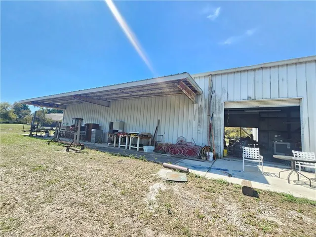 View of outbuilding featuring an attached garage