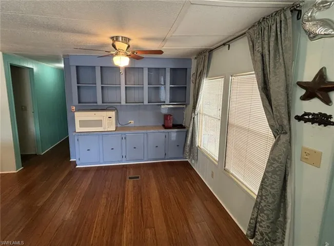 Dining area with built-in storage and display space.
