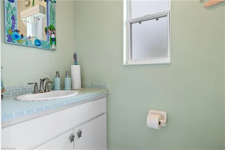 Dedicated Pool bath with toilet and sink. It is so cute!!