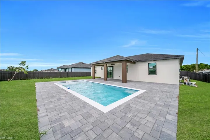 View of swimming pool featuring a patio and a fenced backyard