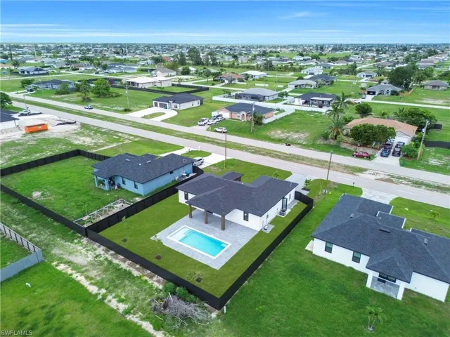 Aerial view of residential area with a pool area