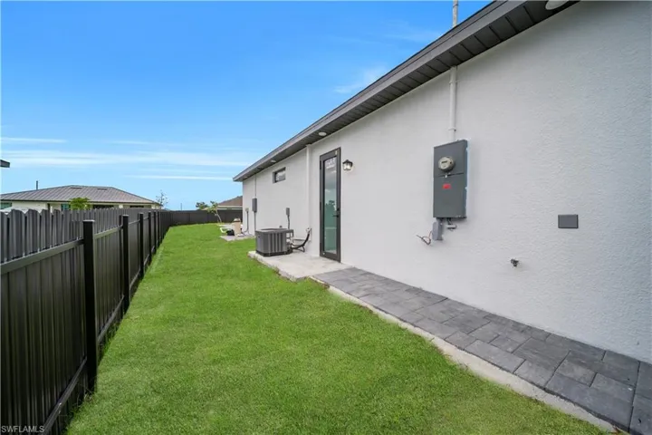 View of fenced backyard