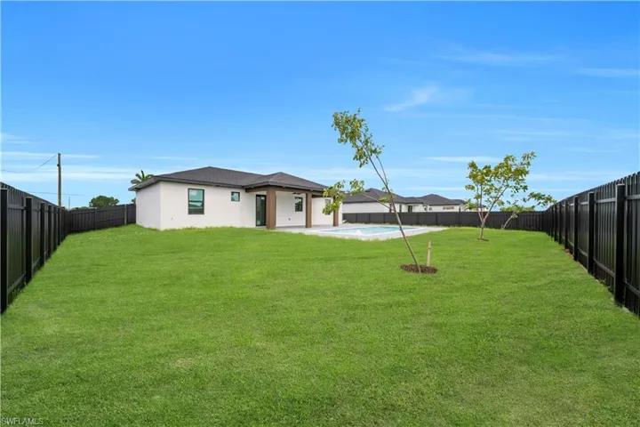 View of fenced backyard