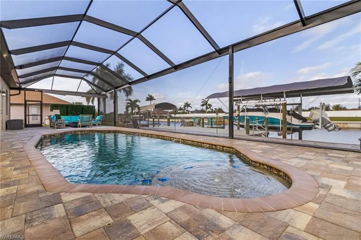 Pool & lanai area and full paver patio beyond