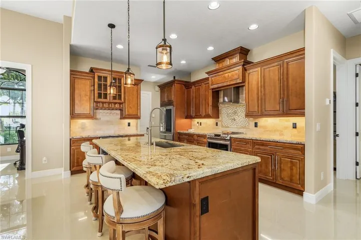 Bar  area, cooktop with direct water, and built in shelves in walk in pantry