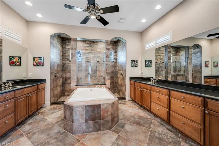 Primary Bathroom with Walk-in Shower and Dual Vanities