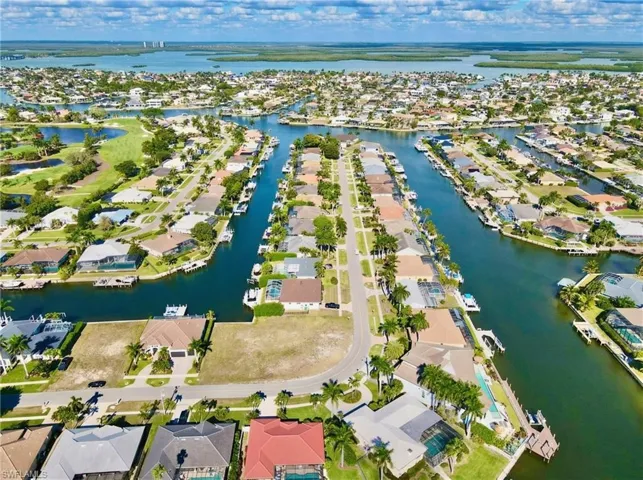 View of property location featuring nearby suburban area and a large body of water