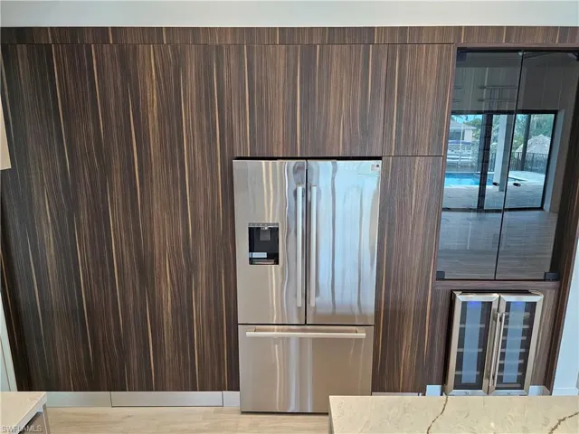 Walk-in hidden pantry and wine bar