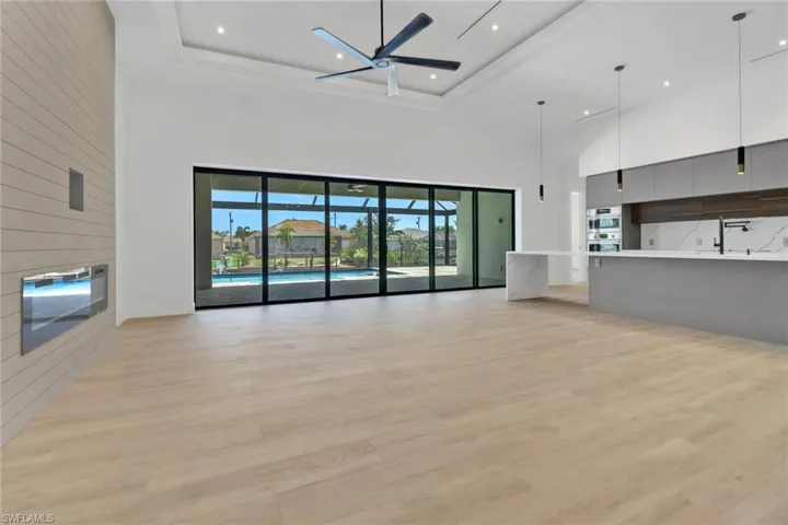 23' wide poceting impact glass doors towards lanai