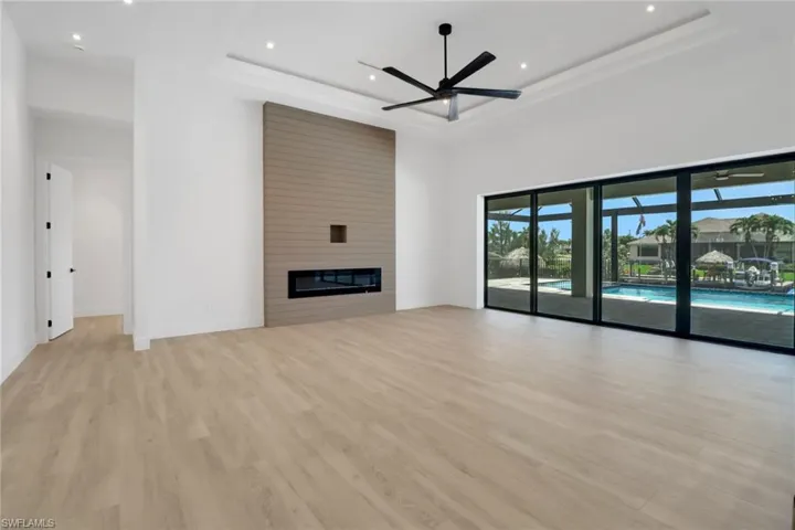 Modern TV wall with 70" electric fireplace and shiplap planking