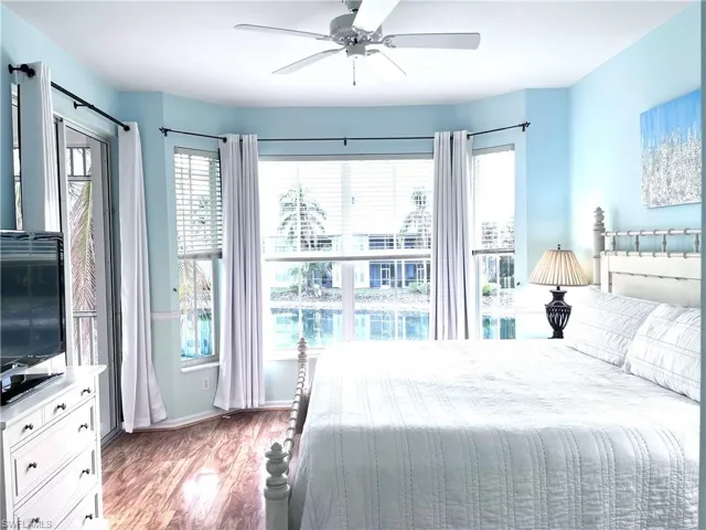 Bedroom featuring wood finished floors and ceiling fan