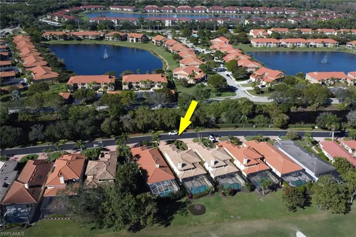 Aerial overview of property's location with a large body of water and nearby suburban area