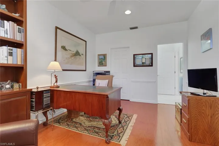 Office space featuring light wood-style flooring and a ceiling fan