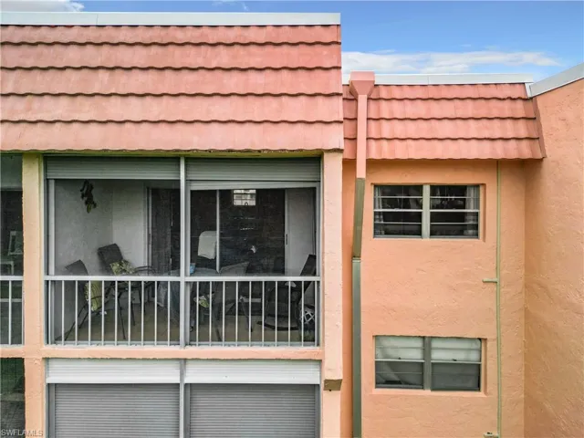 View of side of home with a balcony