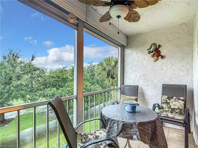 Balcony featuring ceiling fan