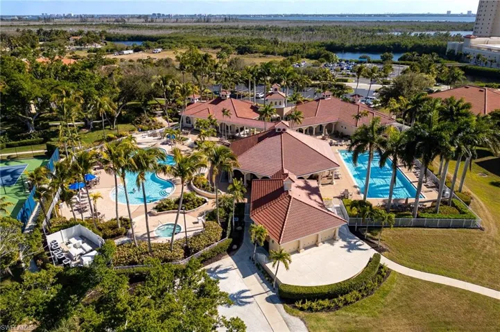 Bird's eye view of a pool area and a large body of water