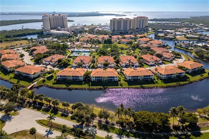 Aerial view of property's location featuring a nearby body of water