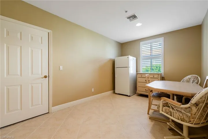 Dining room featuring recessed lighting and light tile patterned flooring