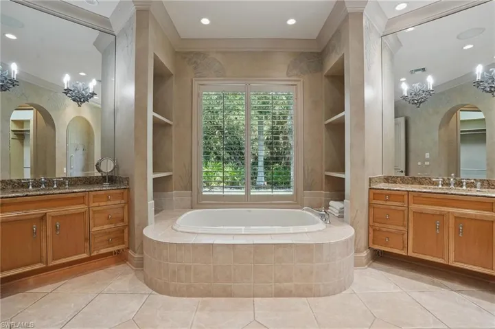 Master bath with split vantiies.