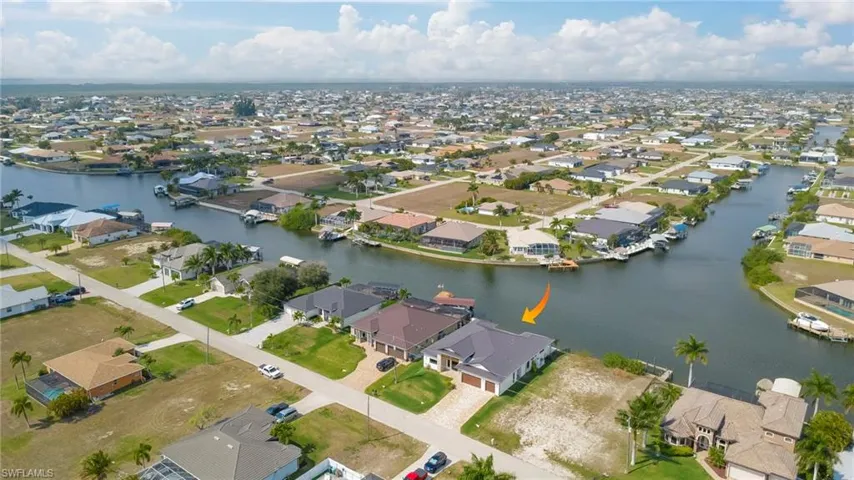 View of property location with a large body of water and nearby suburban area
