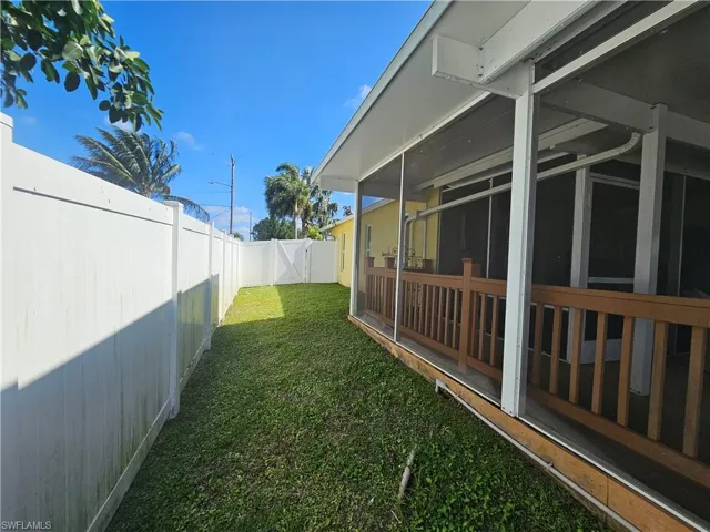 View of yard with a sunroom