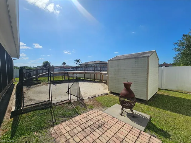 Fenced backyard with a patio
