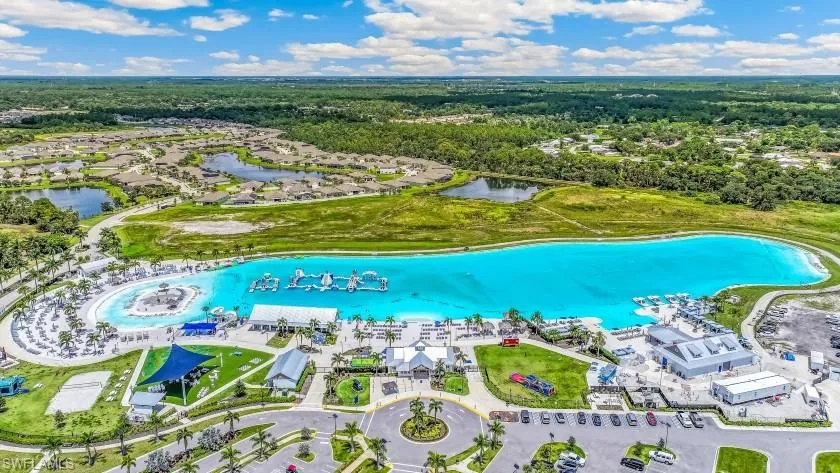 Expansive artificial lagoon with surrounding sandy beaches