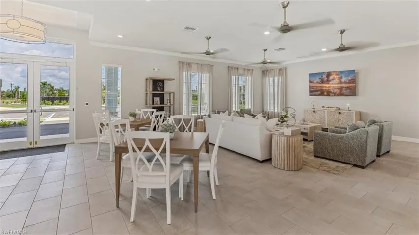 Expansive kitchen island with a light-toned countertop, integrated sink, and seating