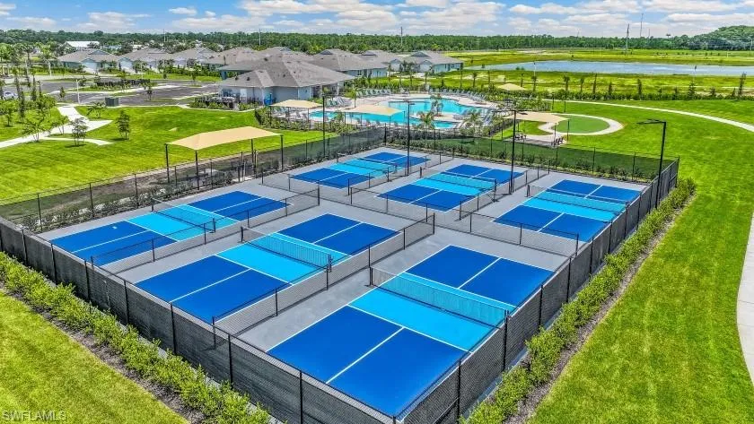 Multiple pickleball courts with blue and light blue playing surfaces
