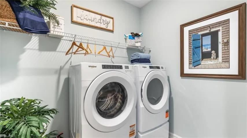 White wall-mounted wire shelving with a clothes hanging rod