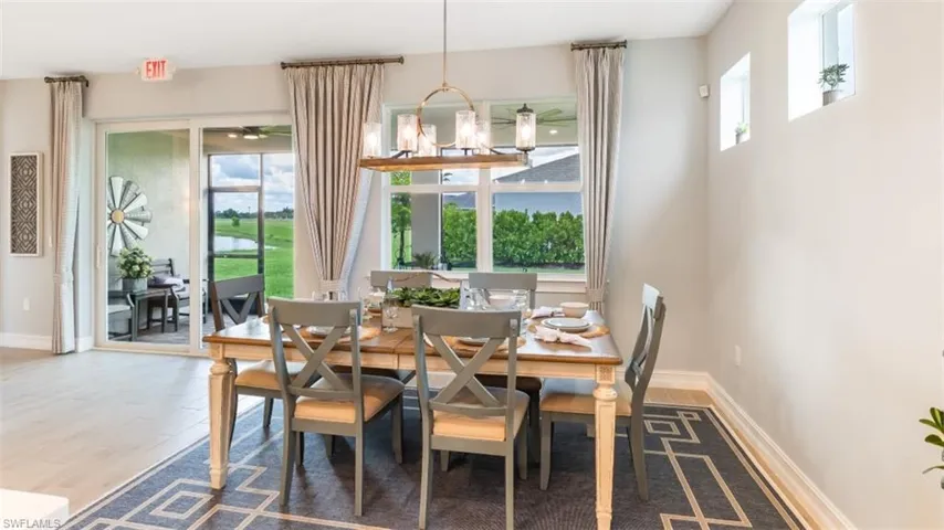 Open-concept dining area with wood-finish flooring