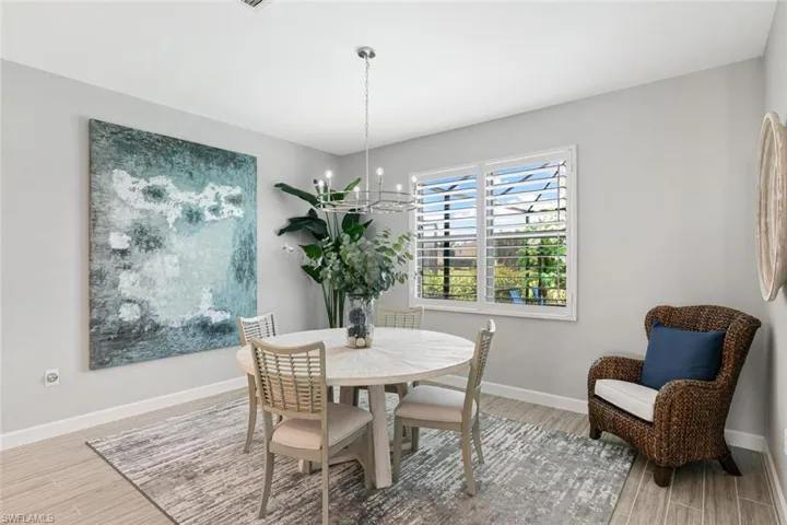 Dining space featuring a chandelier and hardwood / wood-style flooring