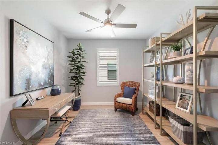 Office space featuring wood-type flooring and ceiling fan