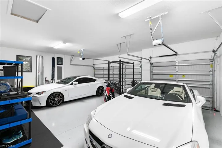 Garage featuring a garage door opener