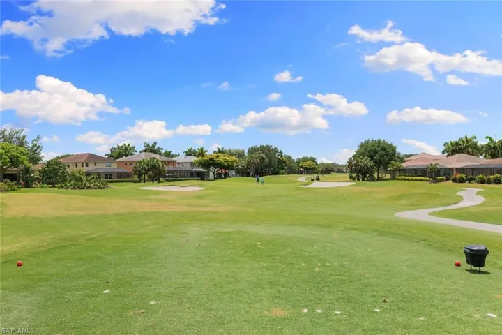 View of property's community featuring a yard