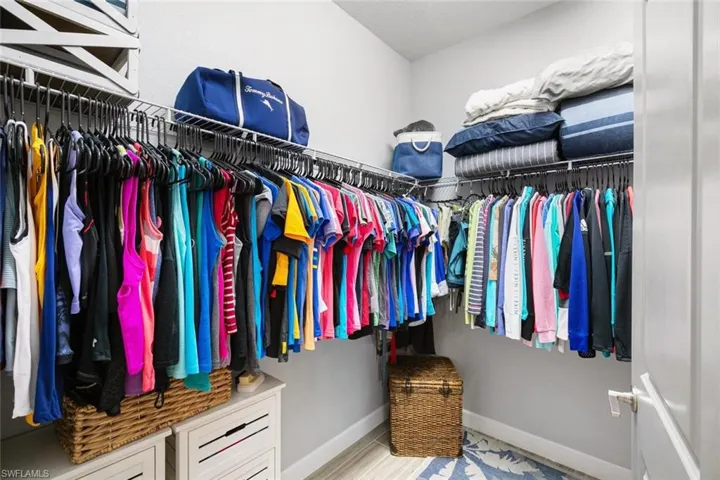 Walk in closet featuring light hardwood / wood-style flooring