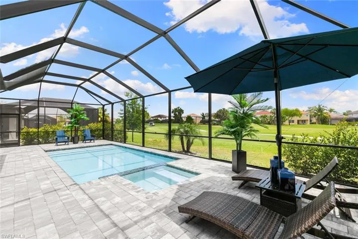 View of swimming pool featuring a lanai, a patio, and a yard
