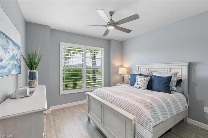 Bedroom featuring ceiling fan and light hardwood / wood-style flooring
